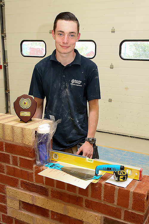 Barnsley Colleges Morgan Chambers, standing in front of his winning work piece, shows off his awards for winning the junior section.