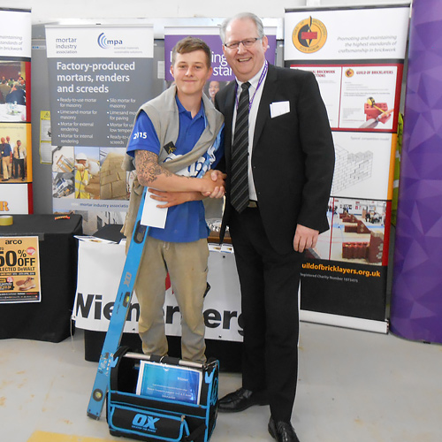 Senior category winner, Henri Couch, receives his award from Fareham College principal and chief executive, Nigel Duncan.