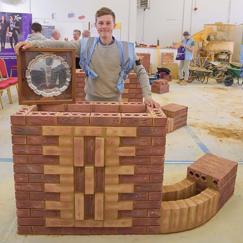 Senior category winner, Henri Couch, stands by his winning project piece after the southern heat of the Guild of Bricklayers competition, held at Fareham College.